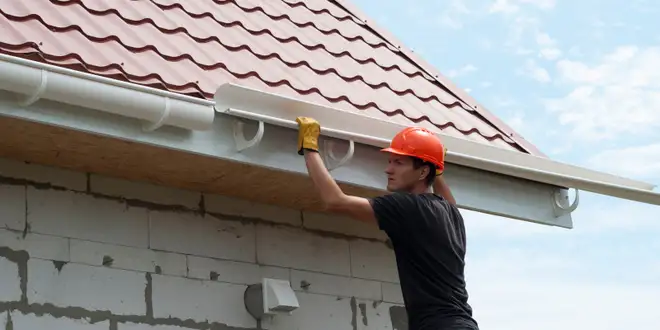 Damaged gutter pulling away from a roofline