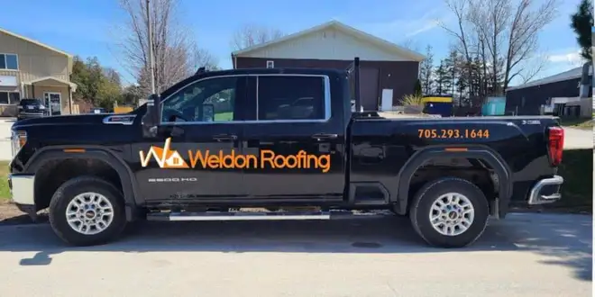 Homeowner reviewing a roofing contract with a contractor