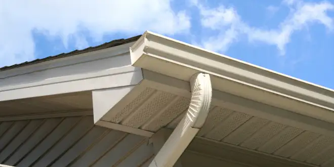 Exterior siding being professionally pressure washed