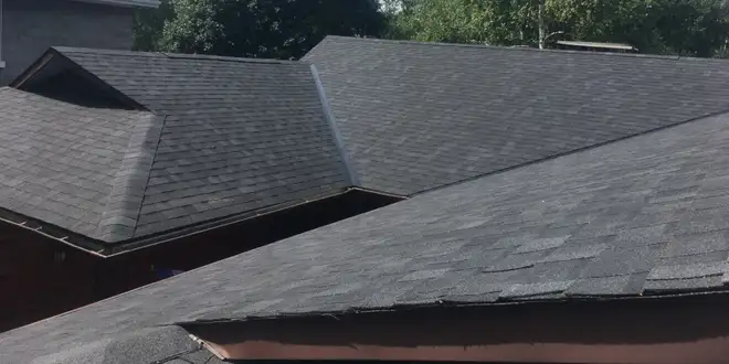 Roofing crew documenting progress during a residential job