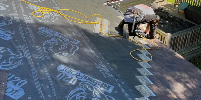 Fresh shingle installation on a newly built roof