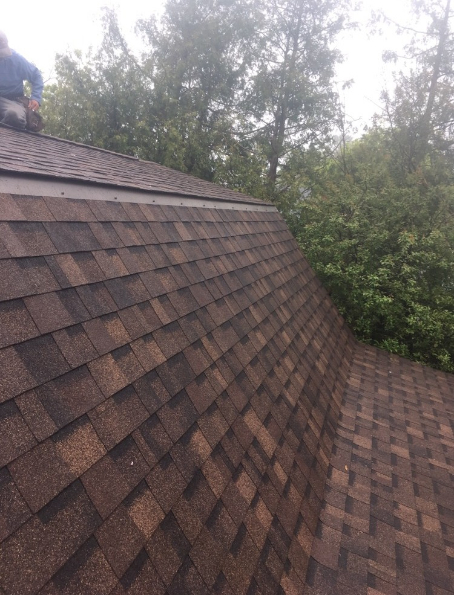 Steep roof with brown architectural shingles during a Weldon Roofing job