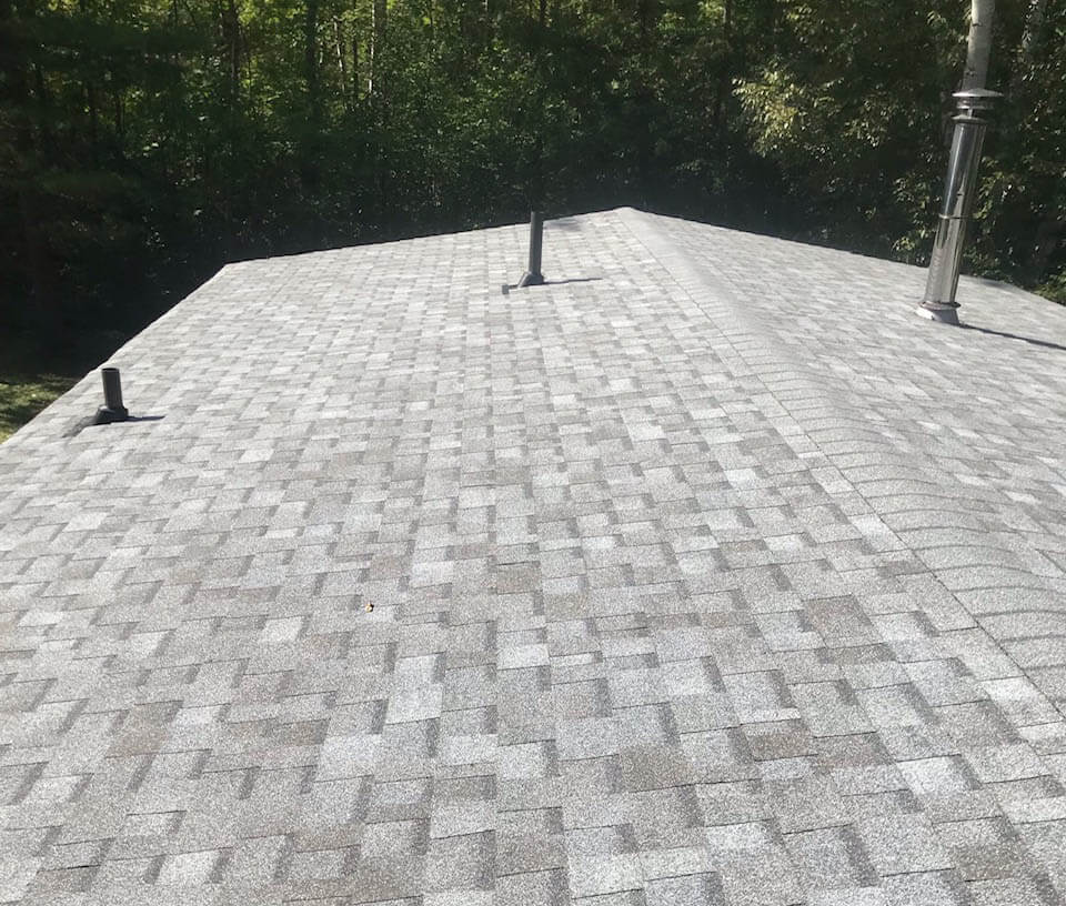 Completed grey shingle roof installed by Weldon Roofing